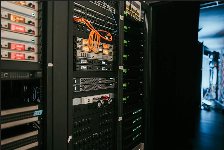 Data center server racks filled with enterprise storage hardware and network cabling for on-premises data storage.